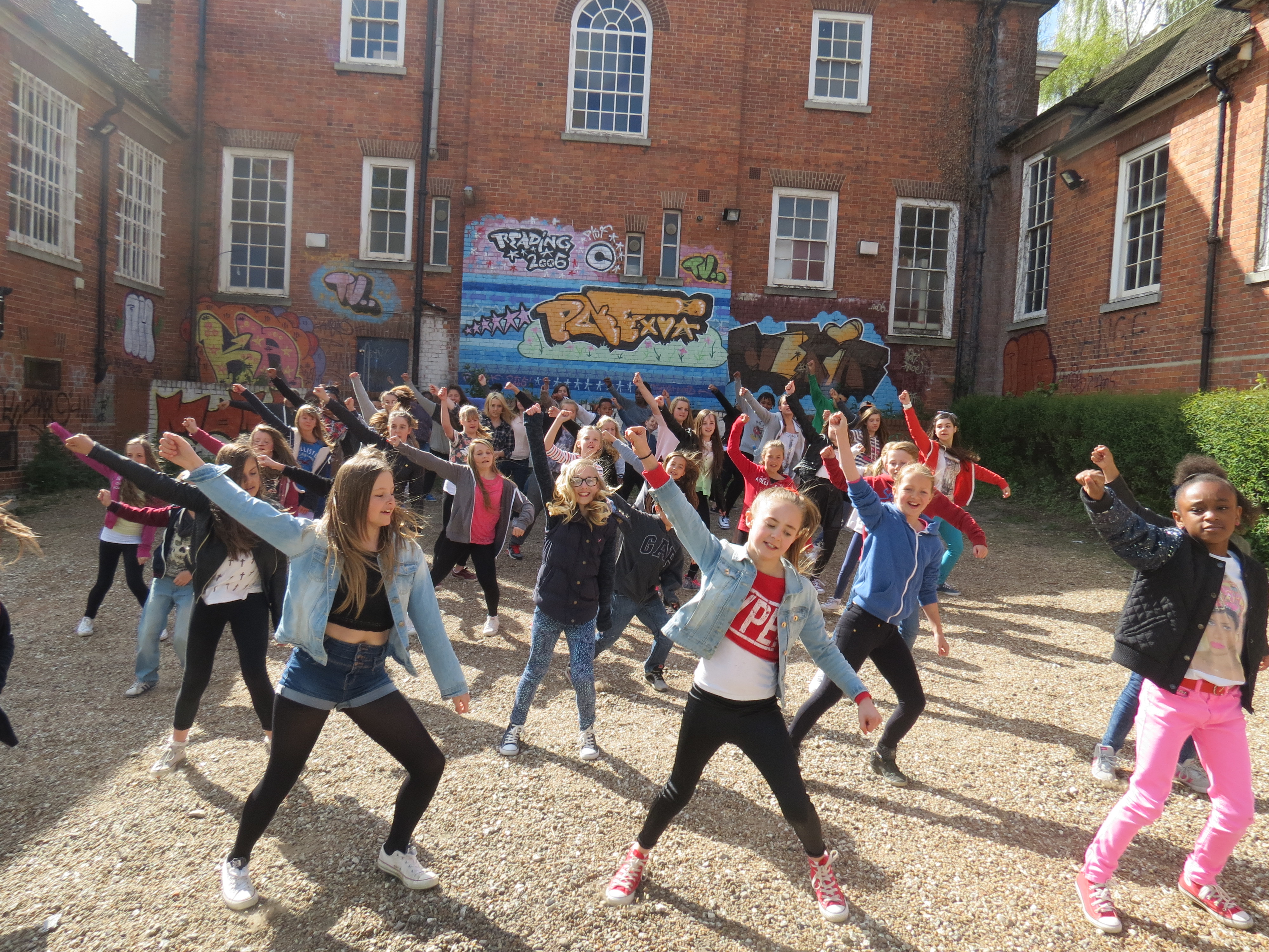 Younger dancers performing outside